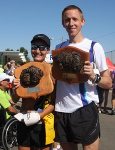 Winners Midori Sperandeo and Brad Poore proudly display their buffalo chip plaques. (Photo and awards by Abe Underwood)