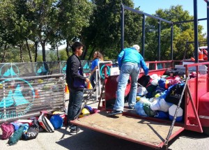 Volunteers sort drop bags at the finish line. (SRN photo)