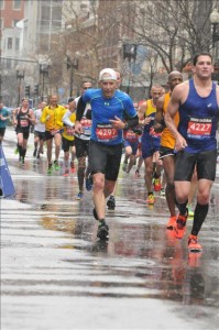 The author running at wet Boston Marathon (Photo courtesy of Dan Weintraub)