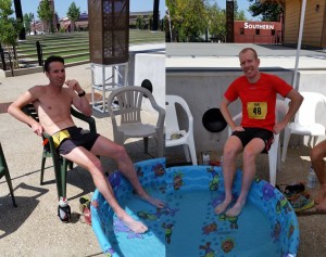 Matt Bachman (left) and Rasmus Hoeg (right) enjoy the finish line wading pool. (SRN photo)